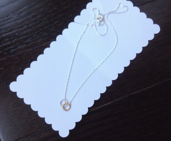 Silver Necklace w/ Gold & Silver Rings Silver Necklace w/ Gold & Silver Rings